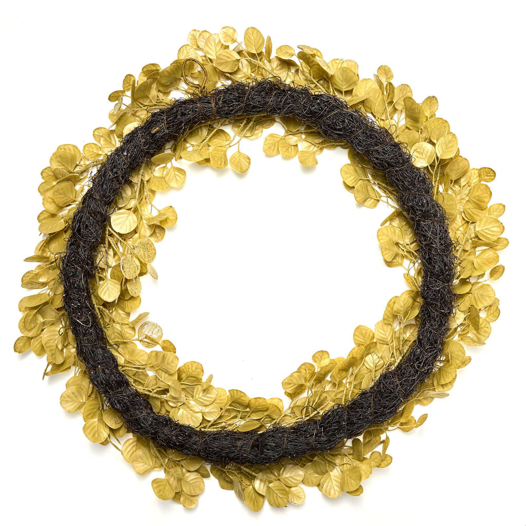 Gold leaf wreath with black tie on a white background