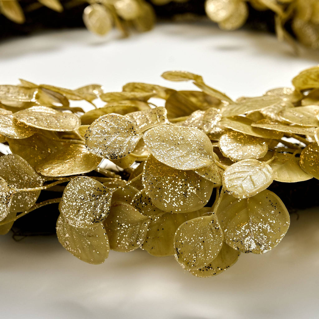 Close-up view of 30 inch gold leaf wreath on a white background