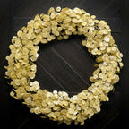 Gold wreath on a dark wooden door