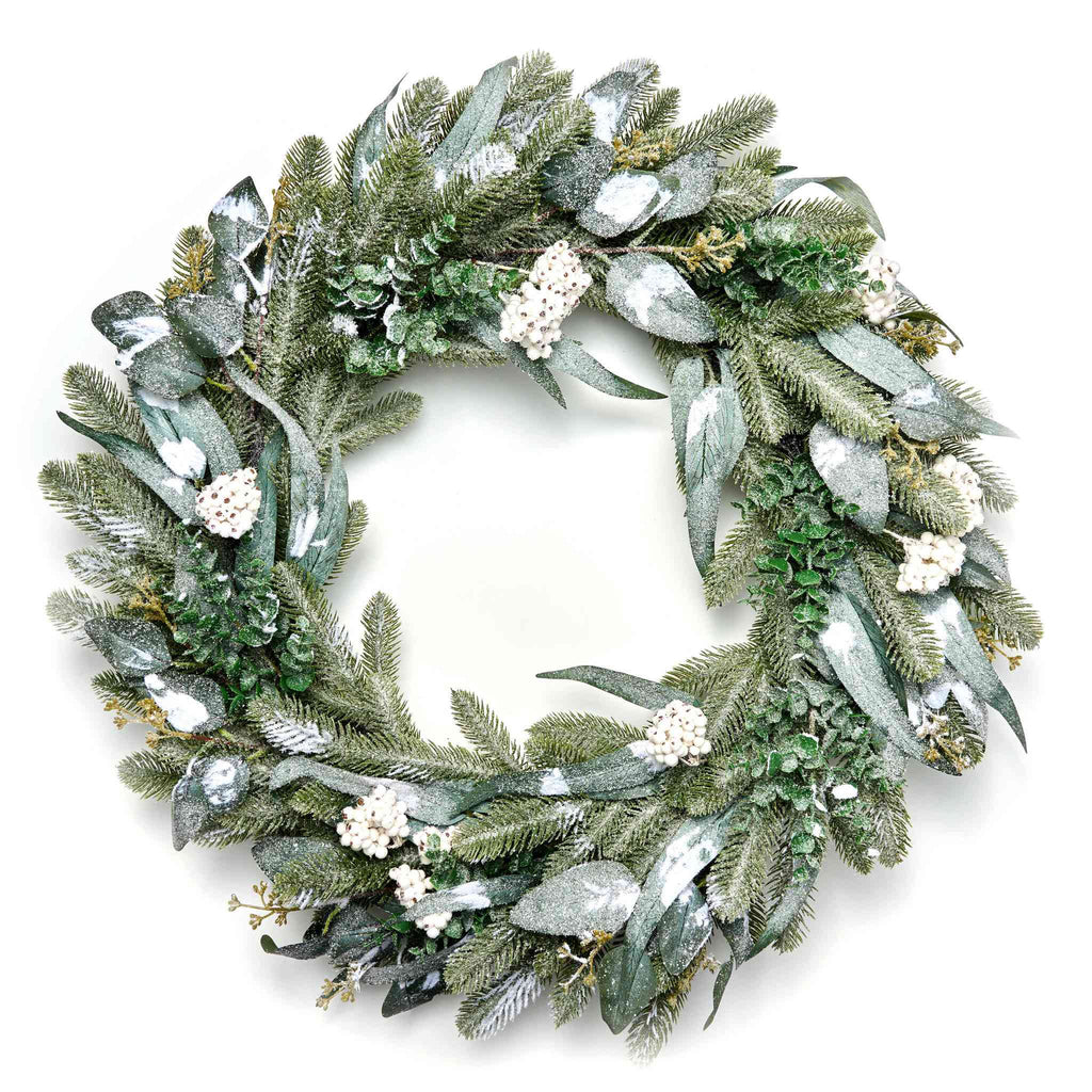 Northern woodland wreath with white flowers on a white background